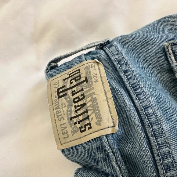 90s silver tab Levi’s. Paint splatter vintage